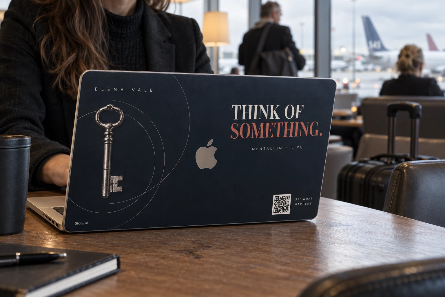 Mentalist laptop skin concept in an airport lounge